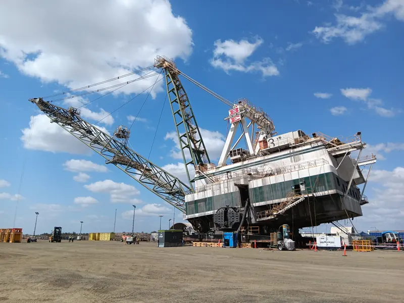 Bucyrus-Erie dragline jacked on the shutdown pad with boom and mast rigged